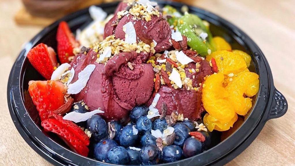 Acai Bowl · Hawaii’s Best Açaí Bowl  /  20 oz. of Organic, Dairy free, Vegan, Gluten free Acai, No Fillers or Juices added. Served with Strawberries, bananas, and blueberries. Side of Granola and honey included.