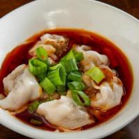 Pork Wontons In Chili Oil' · Spicy. Steamed pork wontons in chili sauce with black vinegar, topped with scallions.