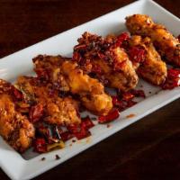 Dry Pepper Chicken Wings' · Spicy. Six dry rubbed flat wings stir-fried with dry chili pepper, long hot peppers, sichuan...