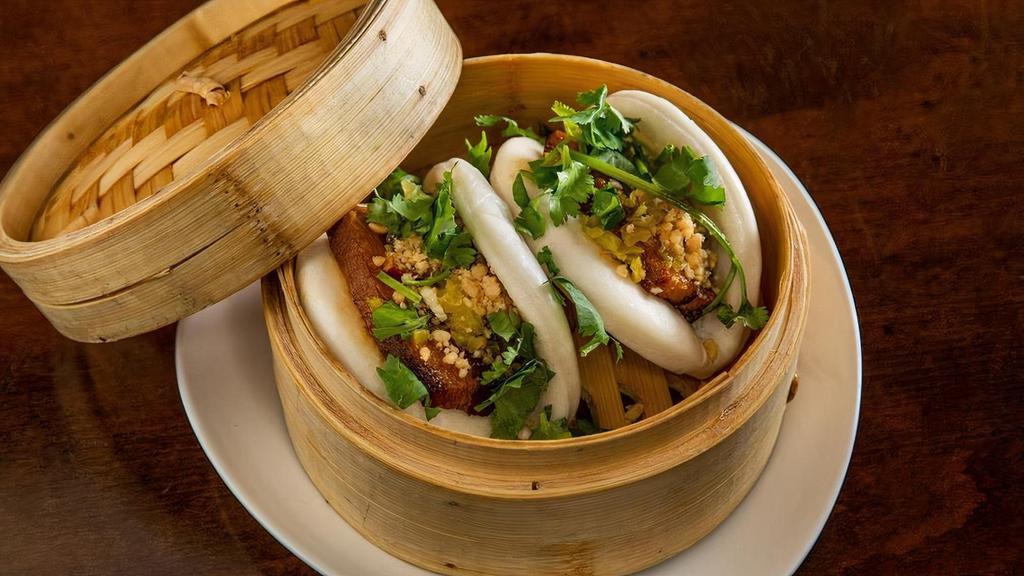 Pork Belly Buns (2Pc)' · Not Spicy. Braised pork belly in bao buns topped with cilantro, crushed peanuts and pickled vegetable.