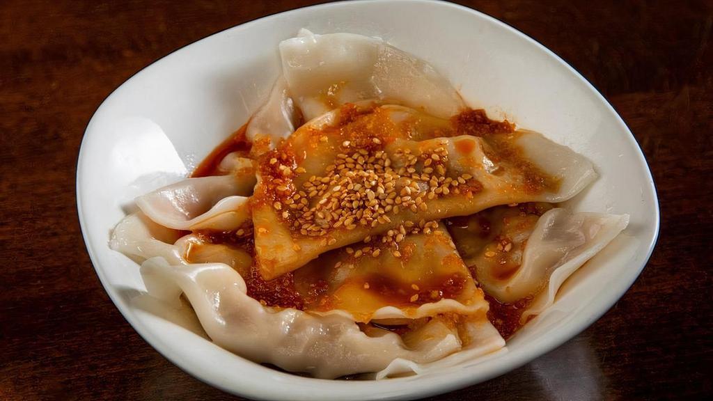 Pork Dumplings In Chili Oil' · Spicy. Steamed pork dumplings in sweet chili sauce, topped with sesame seeds. Chicken or Vegetable option available.