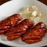Fried Taiwanese Sausage' · Not Spicy. Sweet pork sausage served with fresh garlic slices.