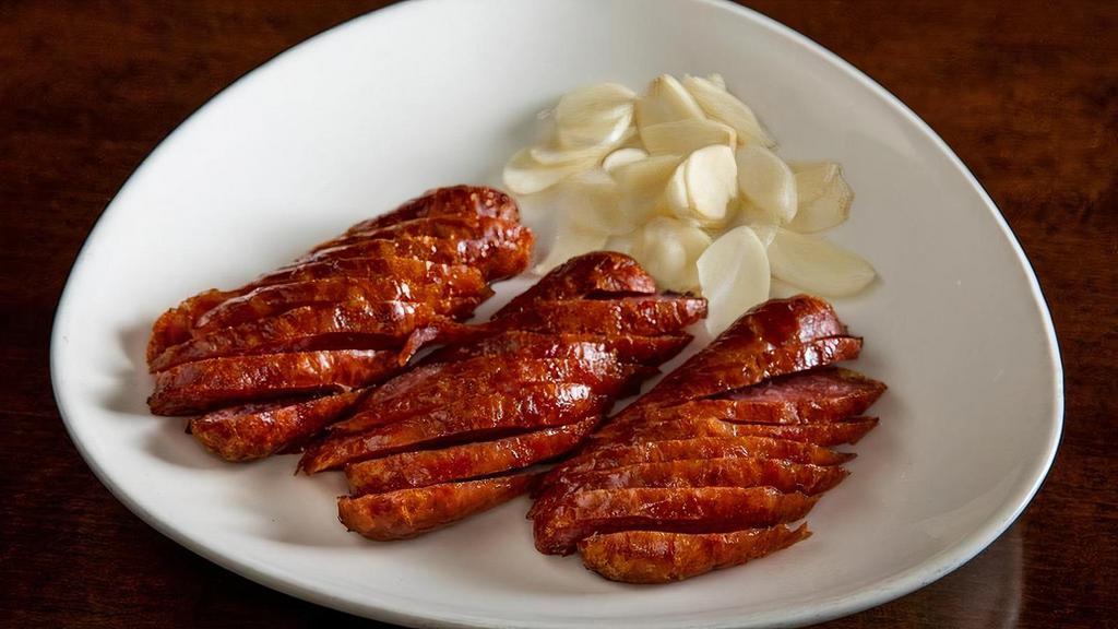 Fried Taiwanese Sausage' · Not Spicy. Sweet pork sausage served with fresh garlic slices.