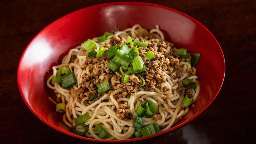 Dan Dan Noodle' · Spicy. Flour noodle tossed with house-made chili oil, sweet soy sauce, sesame paste, scallions & minced pork.