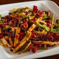 Dry Fry Gf' · Shredded meat stir fried with long hot peppers and bamboo shoots. Spicy.