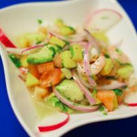 Ceviche Cancun · Shrimp, mango, tomatoes, avocado, lime juice, olive oil, red onions, and cilantro.