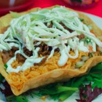 Taco Salad · Grill chicken or steak. Tortilla shell bowl, lettuce, pico de gallo, guacamole, rice, beans,...