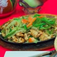 Chicken Fajitas · Sauteed onions and green peppers served with fresh pico de gallo, sour cream, guacamole, and...