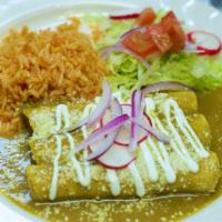 Enchiladas Suizas · Three rolls corn tortillas filled with cheese covered with green sauce, topped with sour cre...