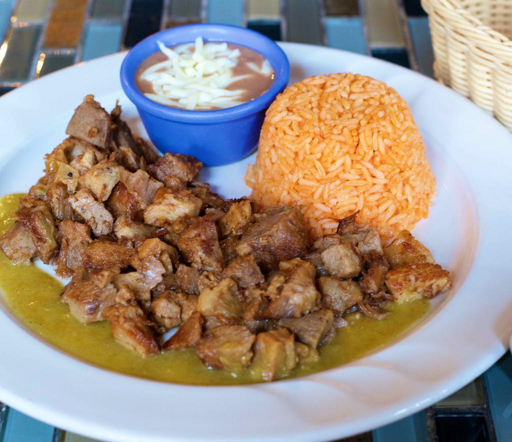 Carnitas (Pork) · Slowed cooked pork and fried with side of pico de gallo and guacamole. Served with rice, beans and corn tortillas.