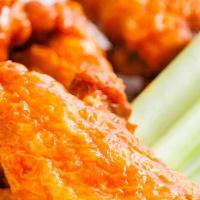 Buffalo Wings · Chicken wings with a breading. Served with celery sticks, frank’s red hot or mild sauce and ...
