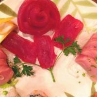 Sashimi · 7 pieces assorted raw fish.