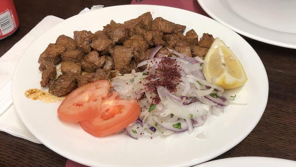 Fried Liver Cubes · Deep fried calf's liver served with onion, tomato, and lettuce.