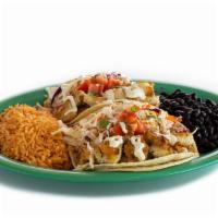 Fish Taco Com · Two tacos w/marinated grilled fish  served w/rice, your choice of beans w/ cabbage & cilantr...