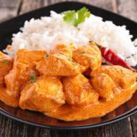 Curry Chicken · 1/2 lb of tender chicken cooked in a hearty curry spiced with Jamaican herbs and flavors.
