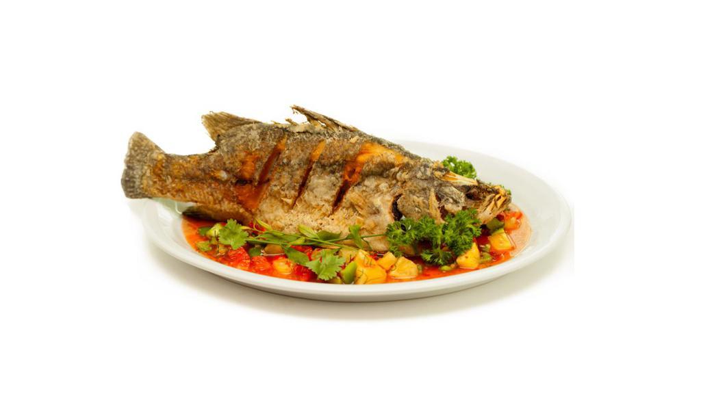 Snapper Fish · This fresh flaky white fish is cooked in your choice of a brown stew, steamed or escovitch (fried and served with spicy vegetables on top). Comes with two sides and gravy.