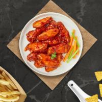 Ride The Buffalo Wings · Fresh chicken wings breaded, fried until golden brown, and tossed in buffalo sauce. Served w...