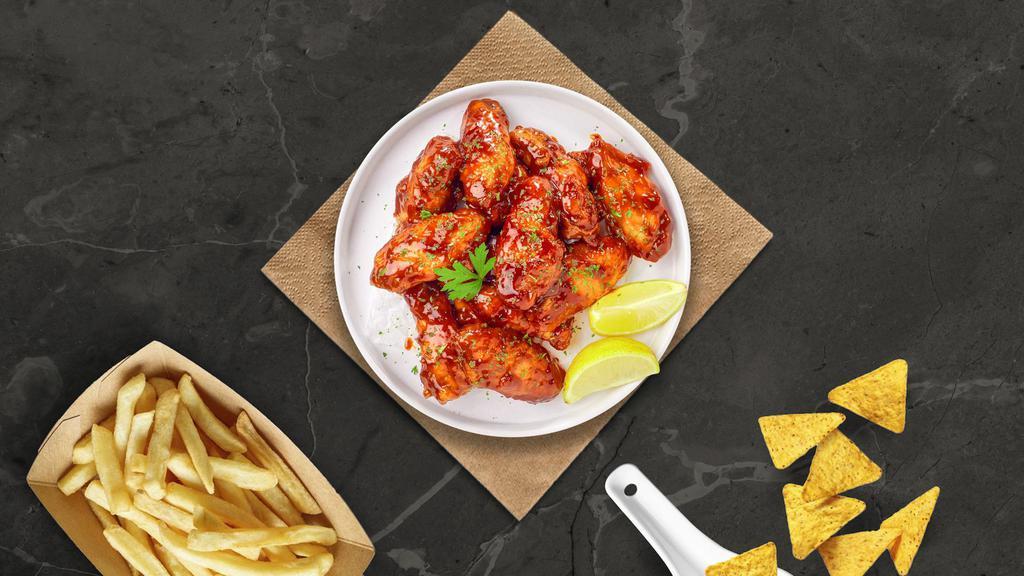 Honey Blaze Wings · Fresh chicken wings breaded, fried until golden brown, and tossed in honey and barbecue sauce. Served with a side of ranch or bleu cheese.