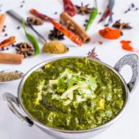 Palak Paneer · Homemade cheese cubes cooked with spinach and herbs.