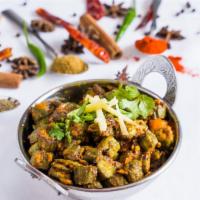 Bhindi Masala · Baby okra sautéed with onions, tomatoes and spices.