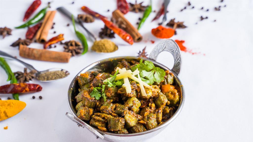 Bhindi Masala · Baby okra sautéed with onions, tomatoes and spices.