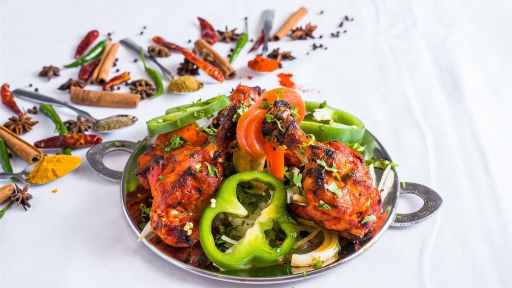 Tandoori Chicken · Chicken on the bone marinated in yogurt and herbs.