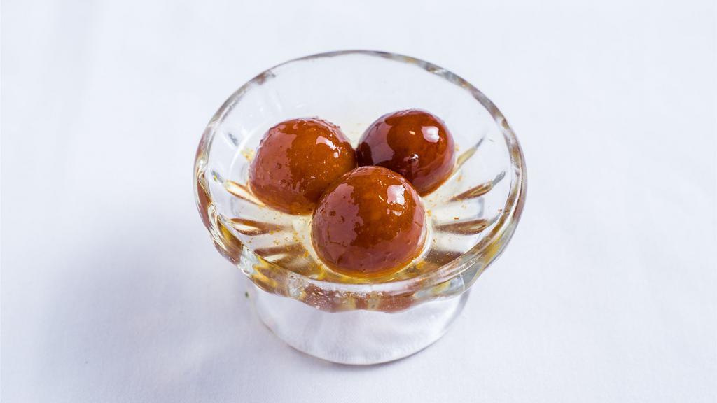 Gulab Jamun · Juicy milk balls in honey syrup.