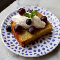 Olive Oil Cake · Seasonal fruit, whipped cream, and mint