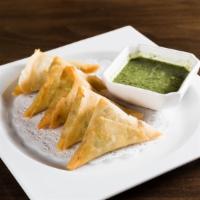 Curry Samosas · With mint chutney dipping sauce.