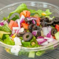 Greek Salad · Romaine lettuce, Feta, tomato, olives, cucumbers, and onions.