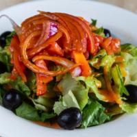 House Salad · Romaine lettuce, red cabbage, olives, red onion and tomatoes.