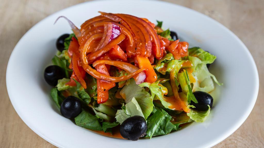 House Salad · Romaine lettuce, red cabbage, olives, red onion and tomatoes.