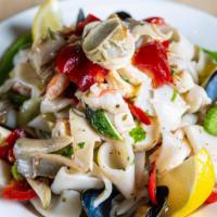 Seafood Salad · Shrimp, calamari, pulpo, mussels, lemon, garlic, olive oil, olives and lettuce.