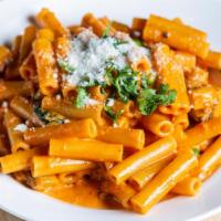 Pasta With Vodka Sauce · Garlic, olive oil, mushrooms, peas, heavy cream and tomato sauce with a touch of vodka.