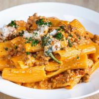 Pasta Bolognese · Tomato sauce with beef, onions and heavy cream.
