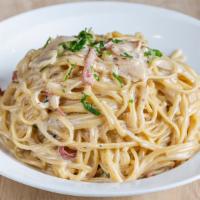 Pasta Carbonara · Onions, garlic and prosciutto in a cream sauce.