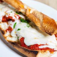 Chicken Cutlet Parmigiana · With tomato sauce and mozzarella cheese.