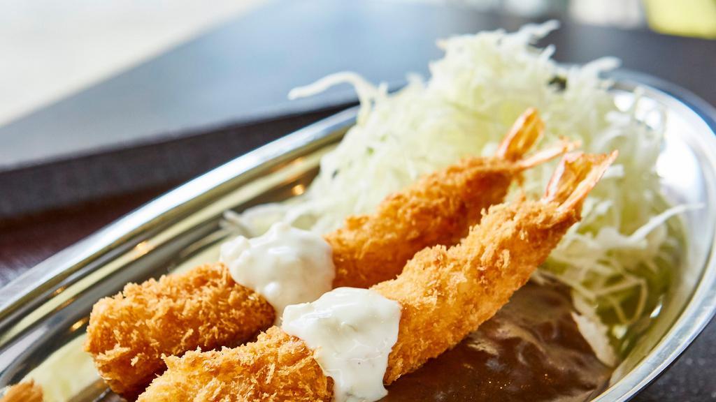 Shrimp  Curry · Two tempura-fried shrimp with tartar sauce, served with Japanese homemade curry over premium Japanese rice and shredded cabbage.  Curry sauce contains pork.