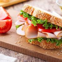 Turkey Sandwich · Turkey, fresh lettuce, juicy tomato and mayo on sliced bread or roll.