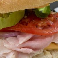 Turkey And Cheese Sandwich · Lettuce, tomato, onions, mayo.