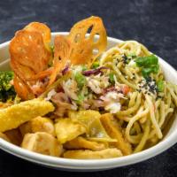 Bangkok Curry Bowl · Peanut noodles, baked red curry tofu, edamame red cabbage slaw, coconut kale and crispy lotu...