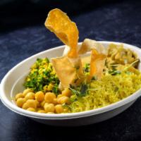 Sri Lankan Buddha Bowl · Yellow basmati rice, chick pea curry, seitan curry, coconut kale and crispy papadum.