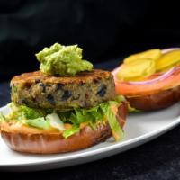 The Tree Hugger · Homemade Plant Junkie Quinoa Burger, lettuce, tomato and chipotle mayo, served on a vegan bun.