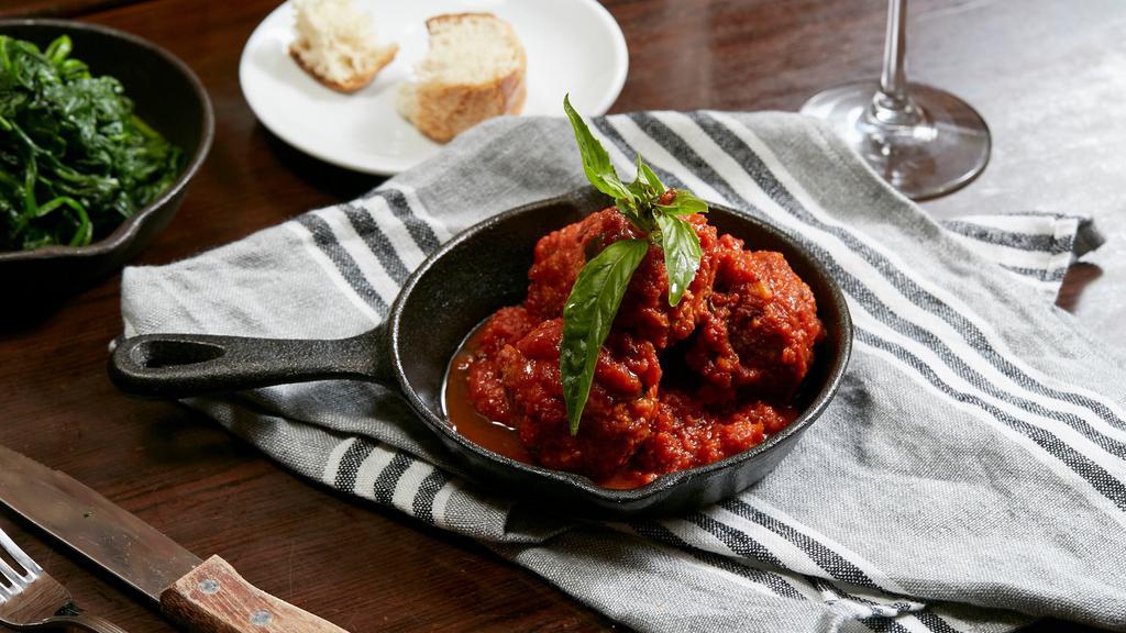 Meat Balls · Three meatballs topped with tomato sauce, Parmesan cheese and basil and crostini