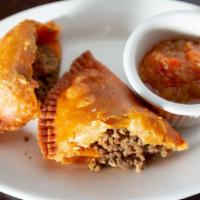 Empanadas · savory fried pastry served with homemade sauce. CHICKEN- BEEF.