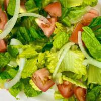 House Salad · a classic romaine salad with onions and tomatoes tossed with special house dressing. simple ...