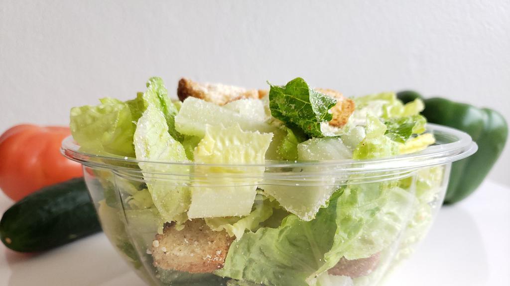 Classic Caesar Salad · Romaine lettuce, shaved and grated Parmesan cheese, croutons, Caesar dressing.