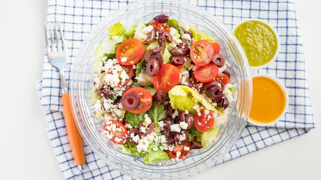 Santorini Salad · Romaine lettuce, Feta cheese, kalamata olives, cucumber, cherry tomatoes, red onions, red and green peppers, fabulous Greek dressing.
