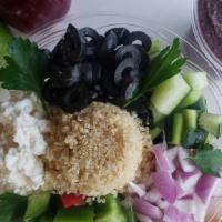 Quinoa Salad · Romaine lettuce, quinoa, Feta cheese, cucumber, peppers, olives, onion, parsley, israeli dre...