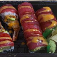 Red Dragon Roll · Raw. Shrimp tempura, avocado and cucumber inside, topped with fresh tuna, eel sauce and spic...
